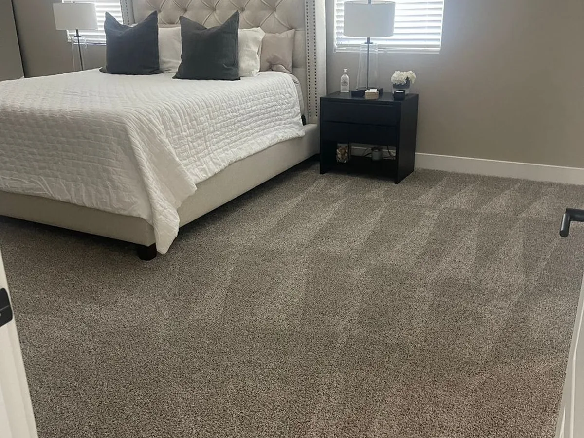 Freshly vacuumed bedroom carpet after a house cleaning by Anna's Housekeeping